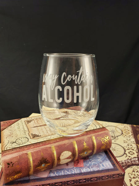 Stemless wine glass with "may contain alcohol" etched.